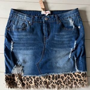 Cute jean skirt with leapord trim. Size M New with Tags
